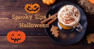 Top view of a creamy Halloween coffee drink on a table with pumpkins around it.